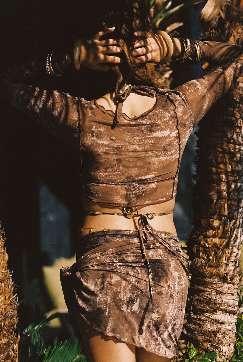Full-length view of the mocha sarong showing the drape and movement.
